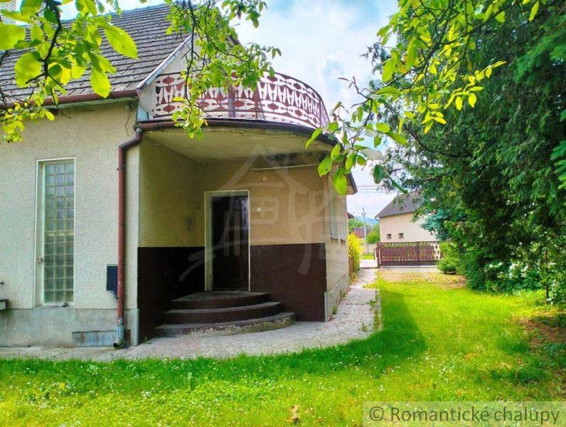 Family house in Košeca with a balcony, terrace surrounded by greenery.