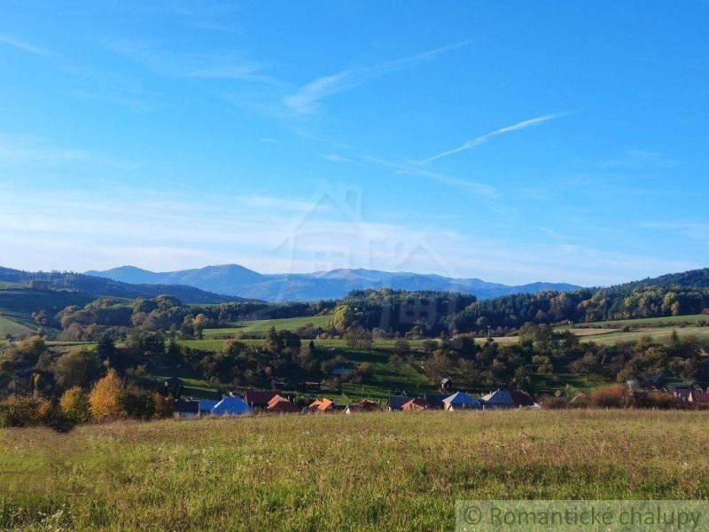 Beautiful country cottages are surrounded by meadows and gardens with views of the hills.