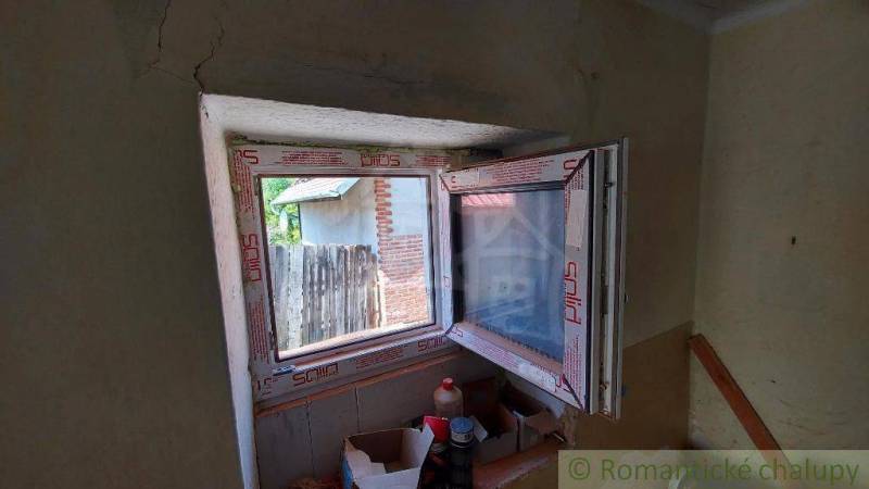 Interior renovation of a family house with a newly installed plastic window.