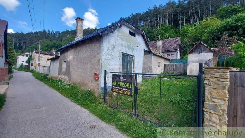 Family house for sale in a picturesque village, surrounded by green forests and tranquility.