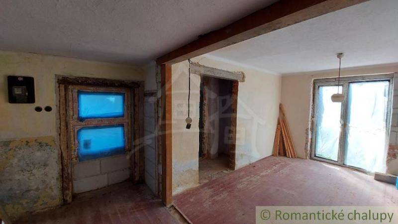 The interior of a family house in the renovation phase, unfinished spaces with wooden details.