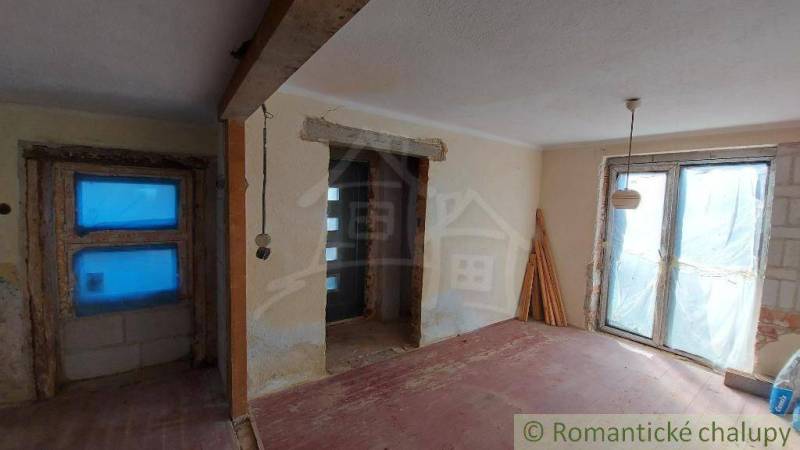 The interior of a family house under renovation with new doors and windows.