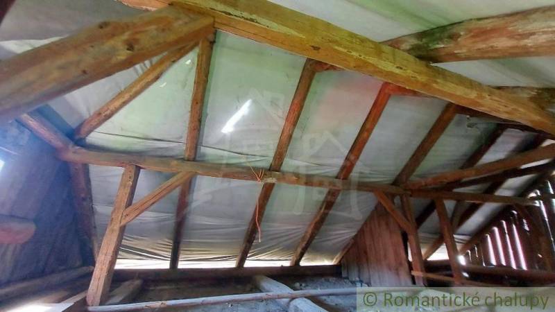 The attic of a family house with wooden beams and covering, typical for romantic cottages.