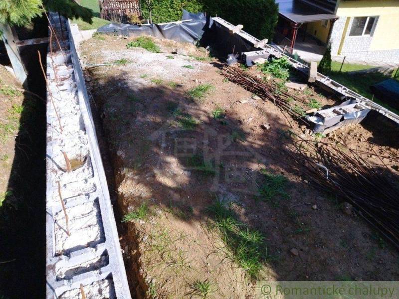 Excavation and foundations for the construction of a retaining wall at a family house.