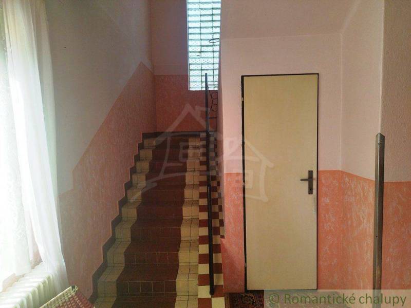 Staircase and doors inside the building, bright walls, entrance, family house.