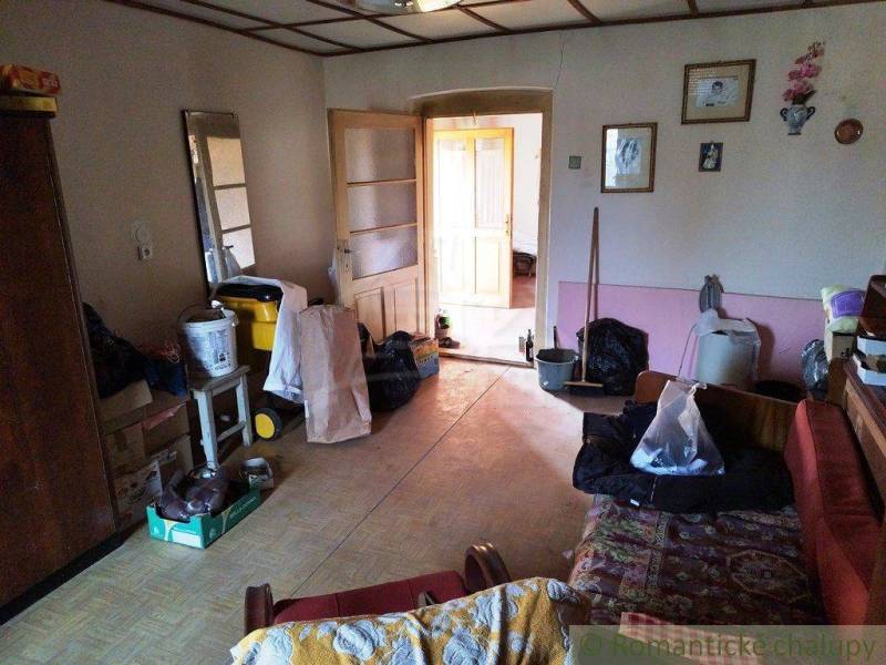 A room full of equipment and furniture in a family house, country style room.