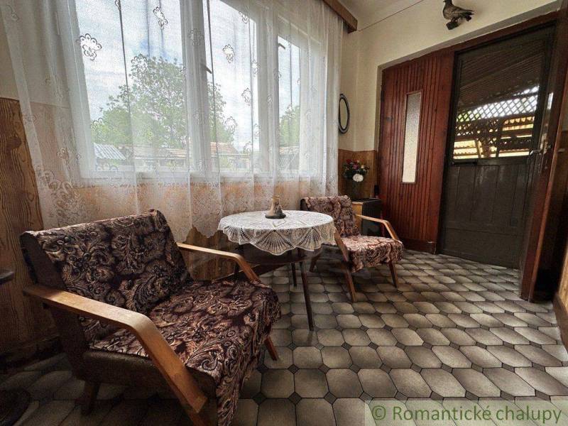 A relaxation corner with armchairs and a table in a family house.