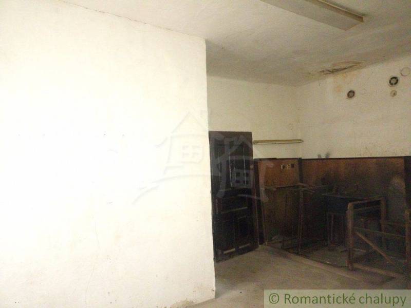 Basement space with an open chamber, missing surface finishes in a family house.