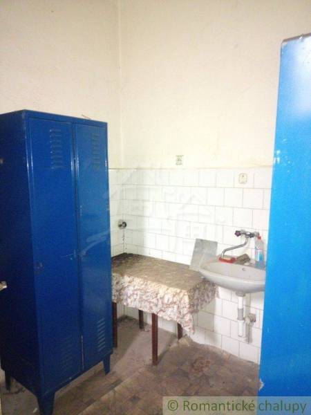 Interior with a blue cabinet, sink, table. A room suitable for a family house.