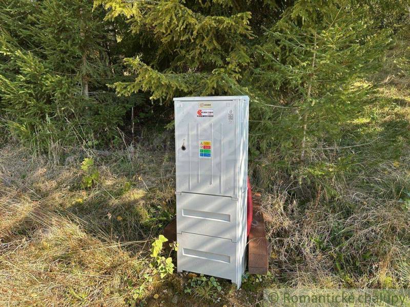 An electrical box near the forest close to a family house, suitable for nature.