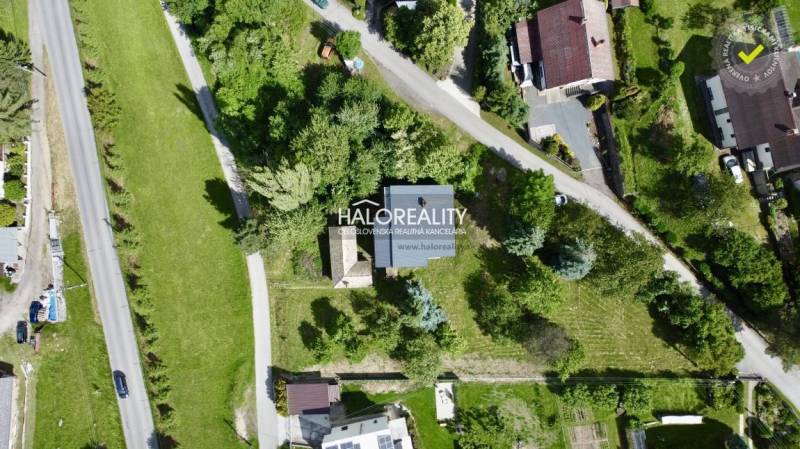 Aerial view of a family house in Nová Baňa surrounded by greenery and a garden.