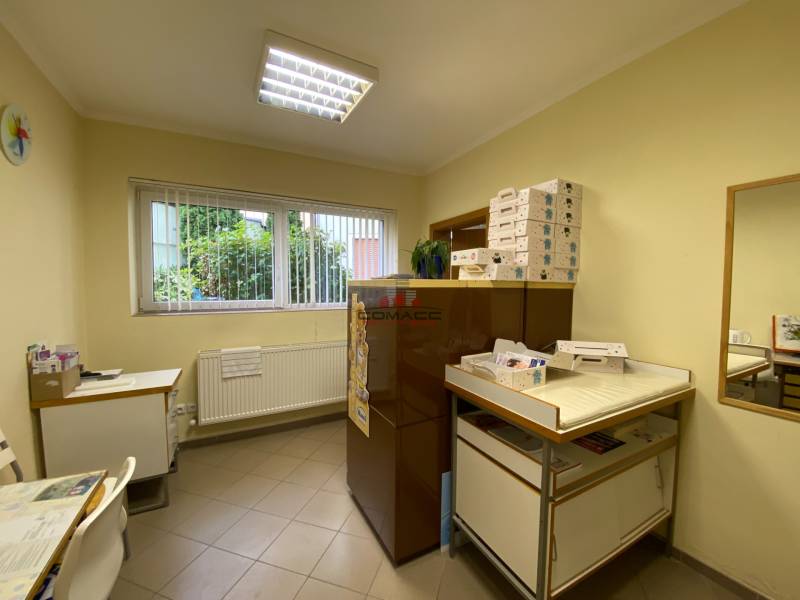 A room with a window, a table, and storage spaces on Nitrianska Street resembles offices.