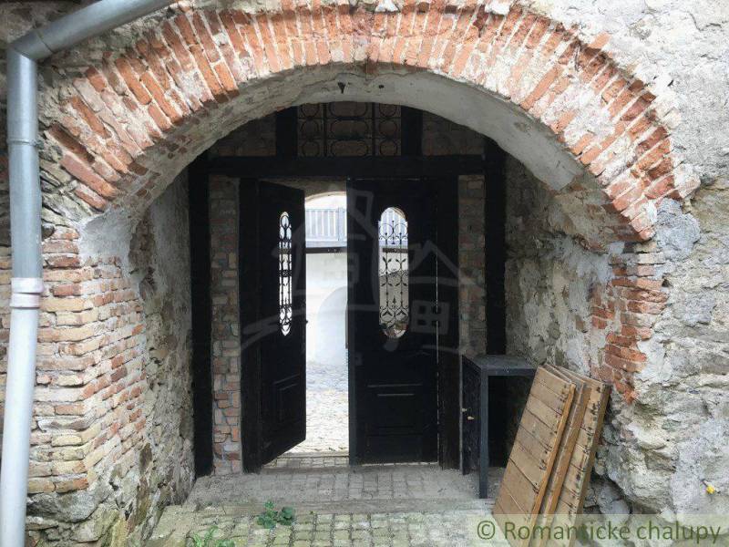 An old brick gate leads into the courtyard, unique architecture and peculiar properties.