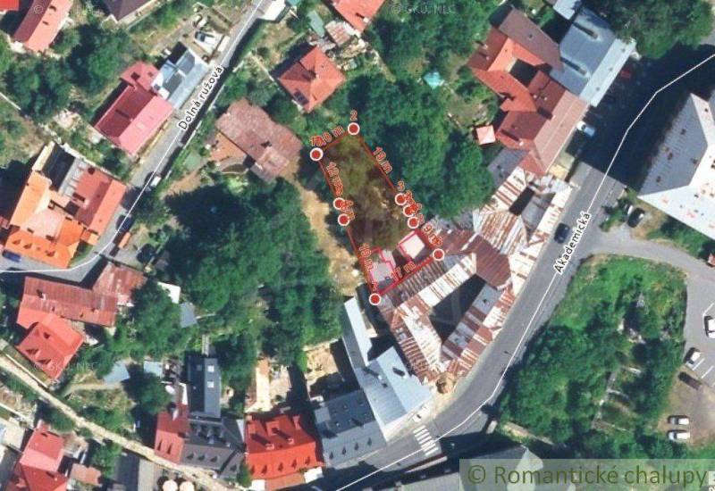 An aerial view shows a peculiar property in a densely built-up area with steep slopes.