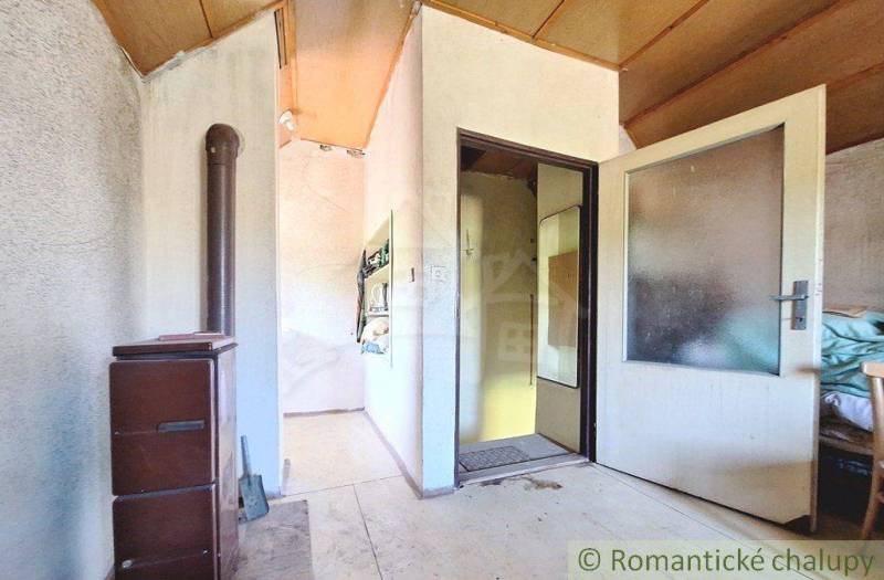 Interior with tiles, open doors, and wooden ceiling in Special Properties.