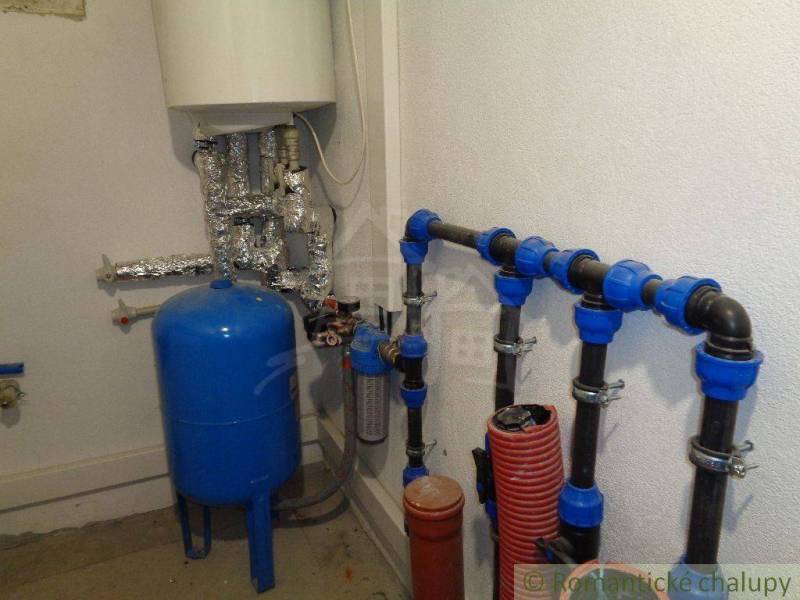 Water supply system in a family house with storage tanks and pipelines.
