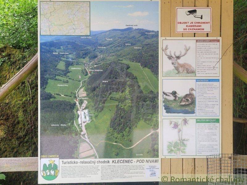 Information board with a map, hiking trail, and agricultural and forest lands in the Záriečie area.