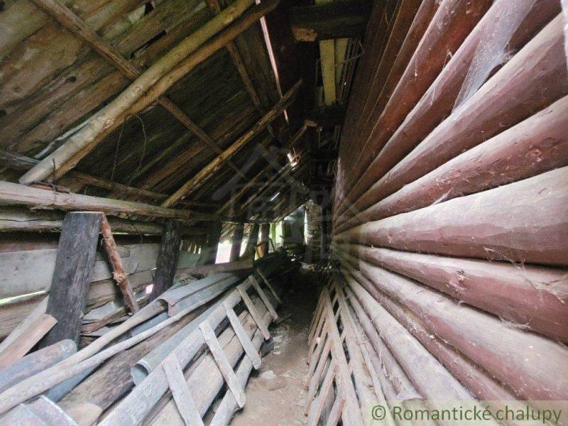 Abandoned wooden structure, rustic interior, old family house with wood and ladders.