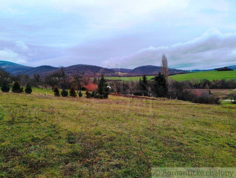Beautiful landscape with predominant agricultural and forest lands, hills in the background.