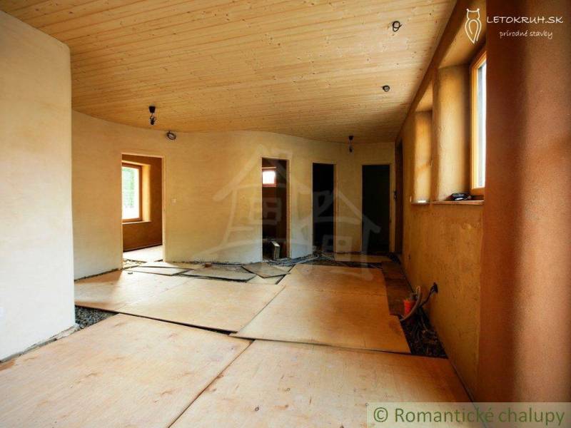 Interior of a house with a wooden ceiling and plaster; family house under renovation.