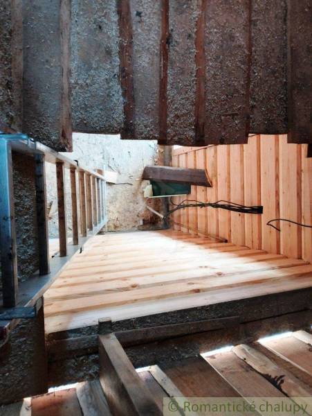 Renovation in the interior of the cottage, new wooden floors, construction work on the cabin.