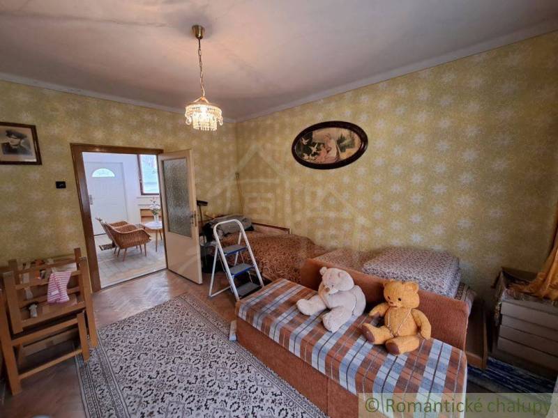 Living room of a family house with plush teddy bears and vintage design.