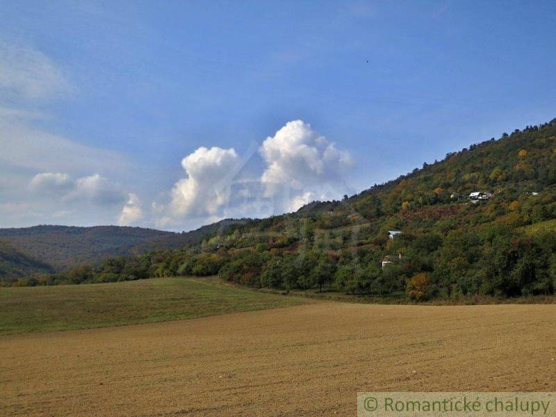 Hills and autumn skies with agricultural and forest lands in the background.