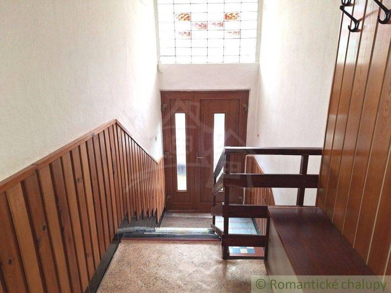 Wooden walls, entrance door, staircase, bright space, family house, cozy living.