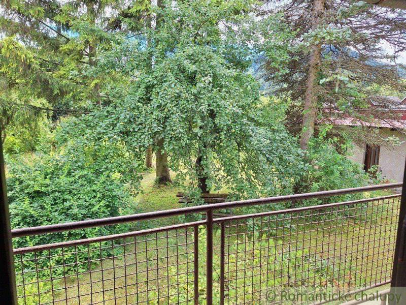 View from the balcony to the garden with trees, ideal plots for peaceful living.