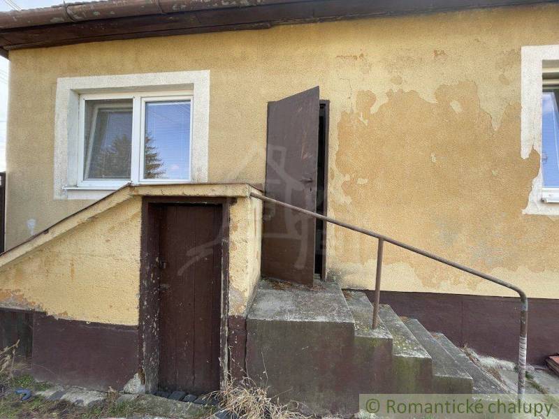 Family house with plaster, staircase, and doors.