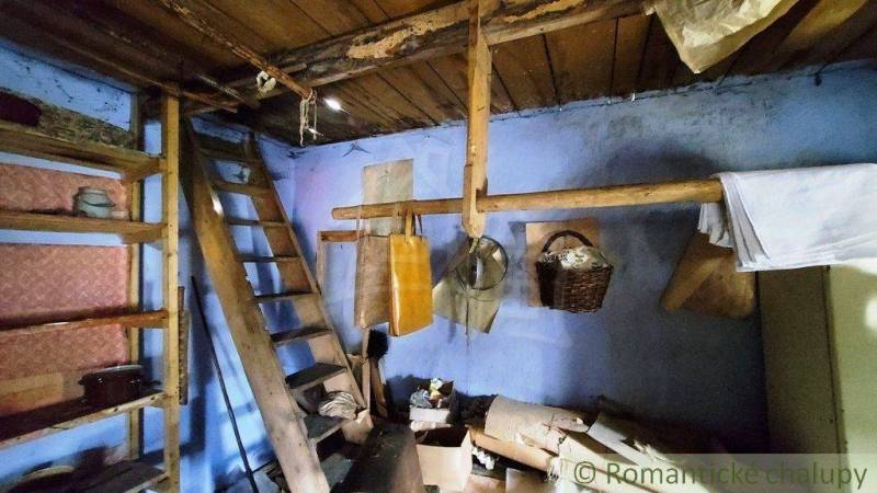 An old wooden ladder in a room with historical equipment. Peculiar properties.