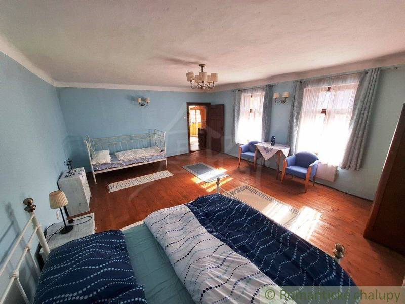 A room in blue color with a bed, properties with a unique interior.