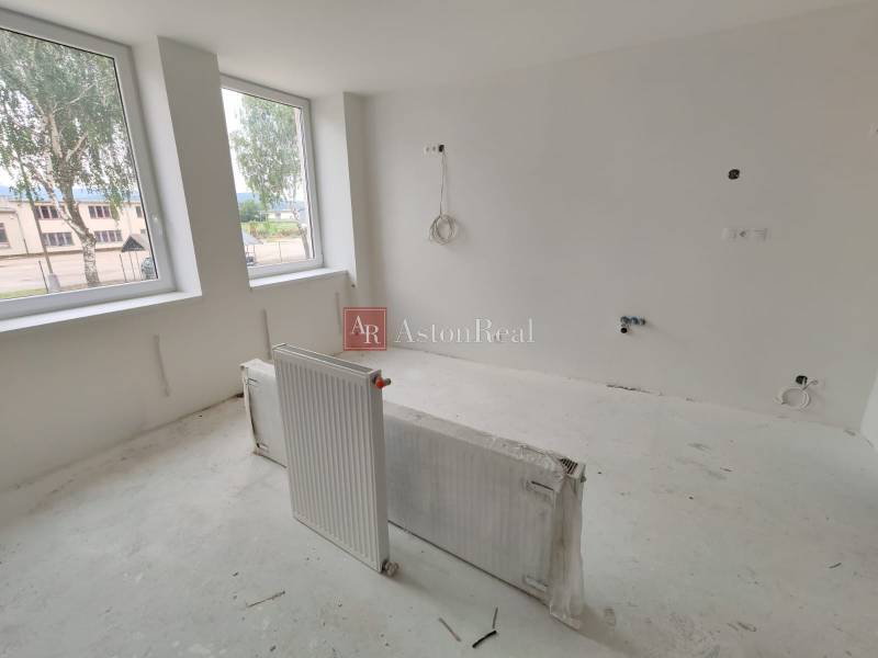 A bright room in a 3-room apartment with renovations and large windows.