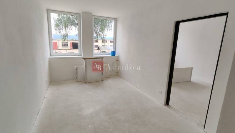 A bright room with two windows in a 3-room apartment.