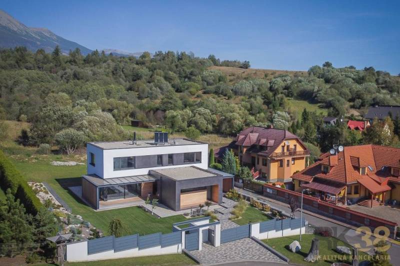 A family house on Tatranská in Nová Lesná surrounded by greenery and neighboring houses.