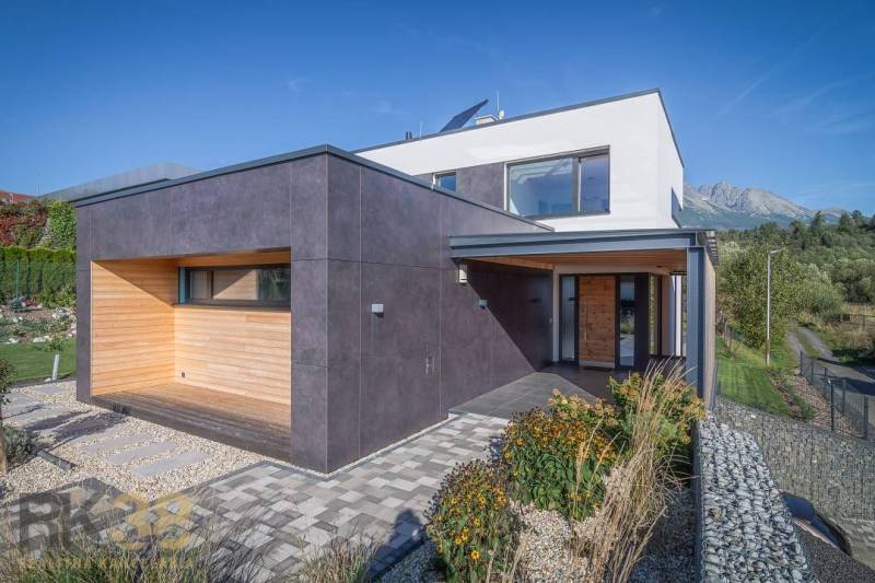 A family house on Tatranská Street in Nová Lesná with wooden cladding and a garden.