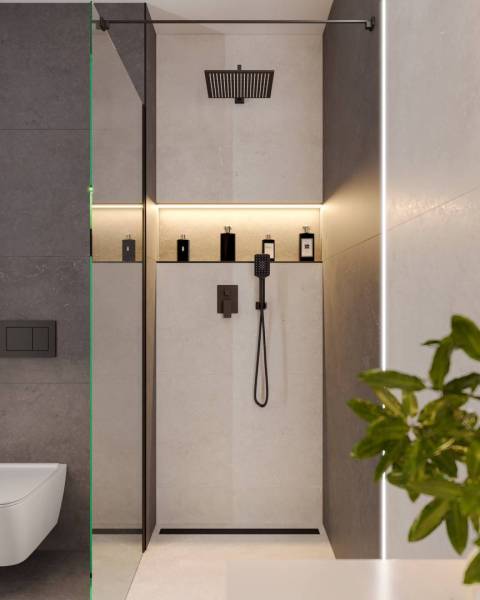 Shower enclosure in a holiday apartment with lighting and a shower head.
