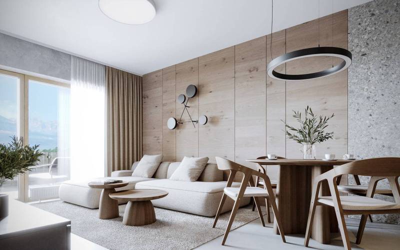 Recreational apartment with wooden furniture, light sofa, and a view towards the balcony.