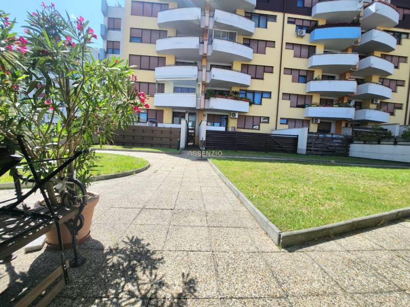Residential complex with balconies on Cikkerova Street, Bratislava - Karlova Ves, surrounded by greenery.