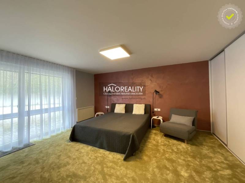 A stylish bedroom in a 3-room apartment with a large window and a comfortable bed.
