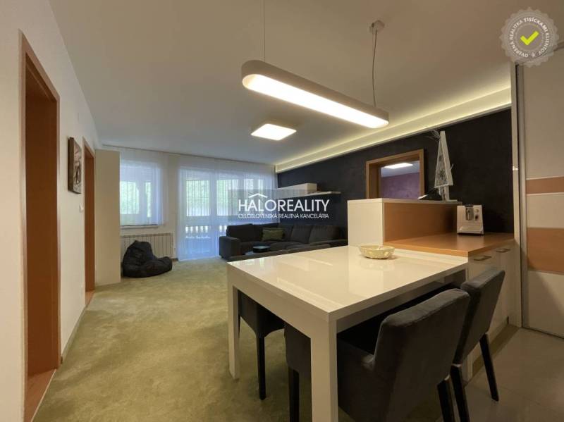 Space in a 3-room apartment with a dining room and living room, light walls, wooden accents.