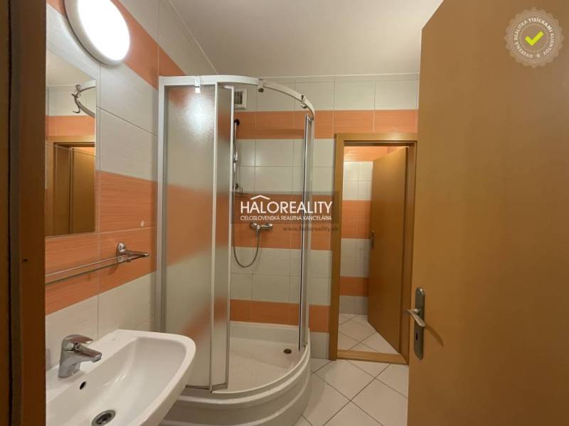 A bathroom with a shower and a sink in a 3-room apartment.