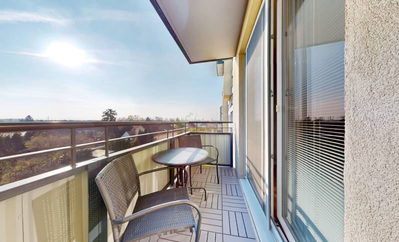 The balcony of a 3-room apartment on Kazanská Street in Bratislava-Vrakuňa with a view of the surroundings.