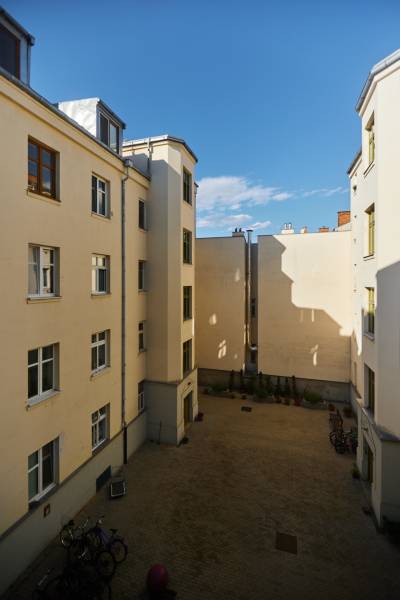 A courtyard surrounded by residential buildings on Vodná Street in Košice - Staré Mesto district.