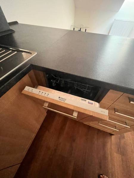 A kitchen unit with a built-in dishwasher in a 3-room apartment.