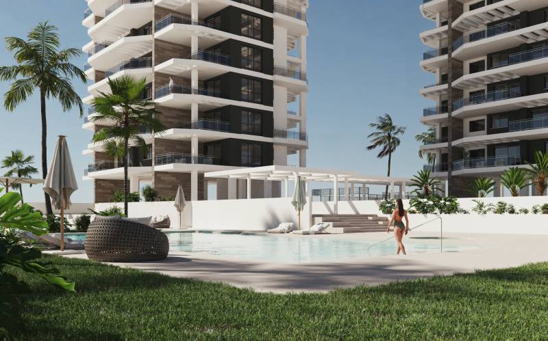 Apartments with a pool and palm trees in Calpe, ideal for a 3-bedroom apartment.