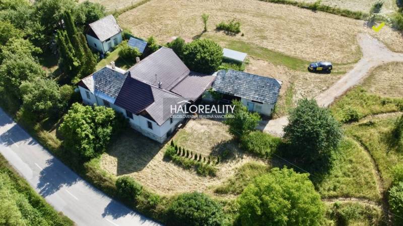 A family house in Ploské surrounded by nature and accessible via a road.