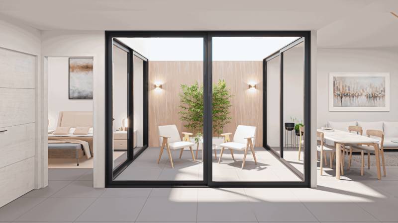 A glazed terrace with furniture on the ground floor of a family house, an open space for relaxation.
