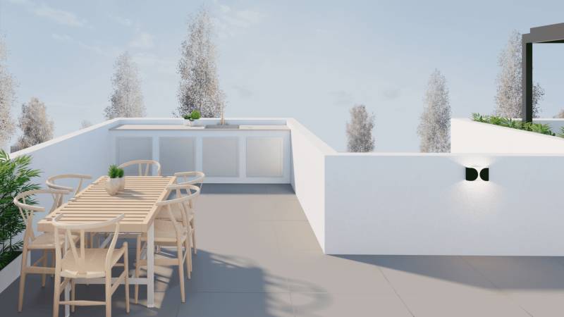 Terrace of a family house in San Pedro del Pinatar with a wooden table and chairs.