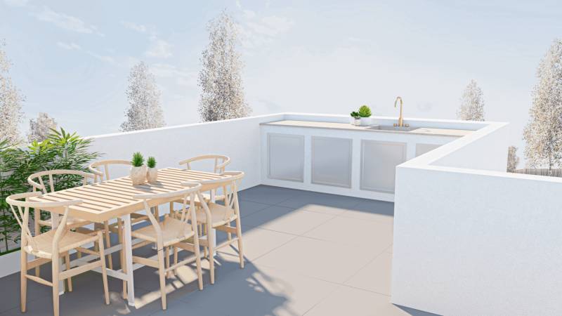 There is a terrace with wooden furniture and an outdoor kitchen in the family house.